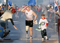 Clearwater Marathon PIM 026  A handicapped runner is escorted by his son doing the Clearwater Ironman. - PhotosinMotion.net. : handicapped runner pictures, handicapped runners in the Clearwater Ironman, Clearwater Ironman photographs, Clearwater sports photographerLOCAL, SPORTS, MARATHON photographer
